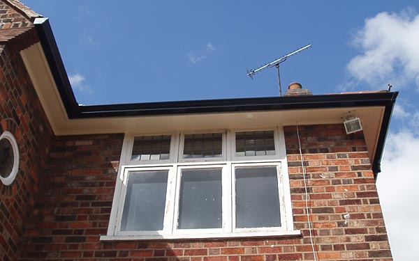 Black guttering with white fascias soffits