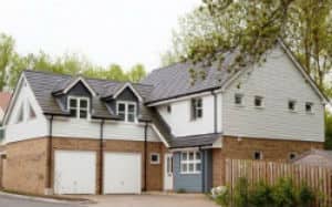 Cladding installed to top half of home