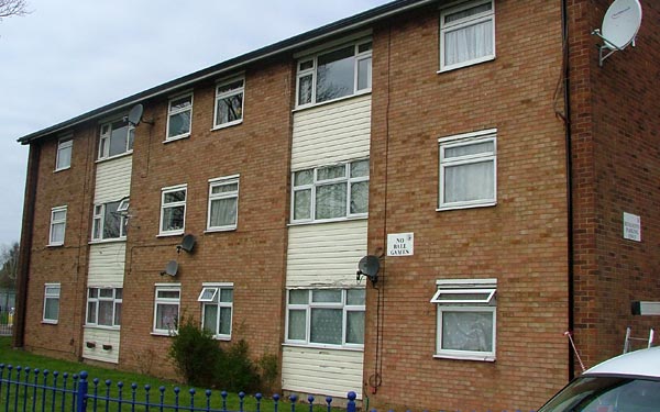 Cladding installed to top half of home